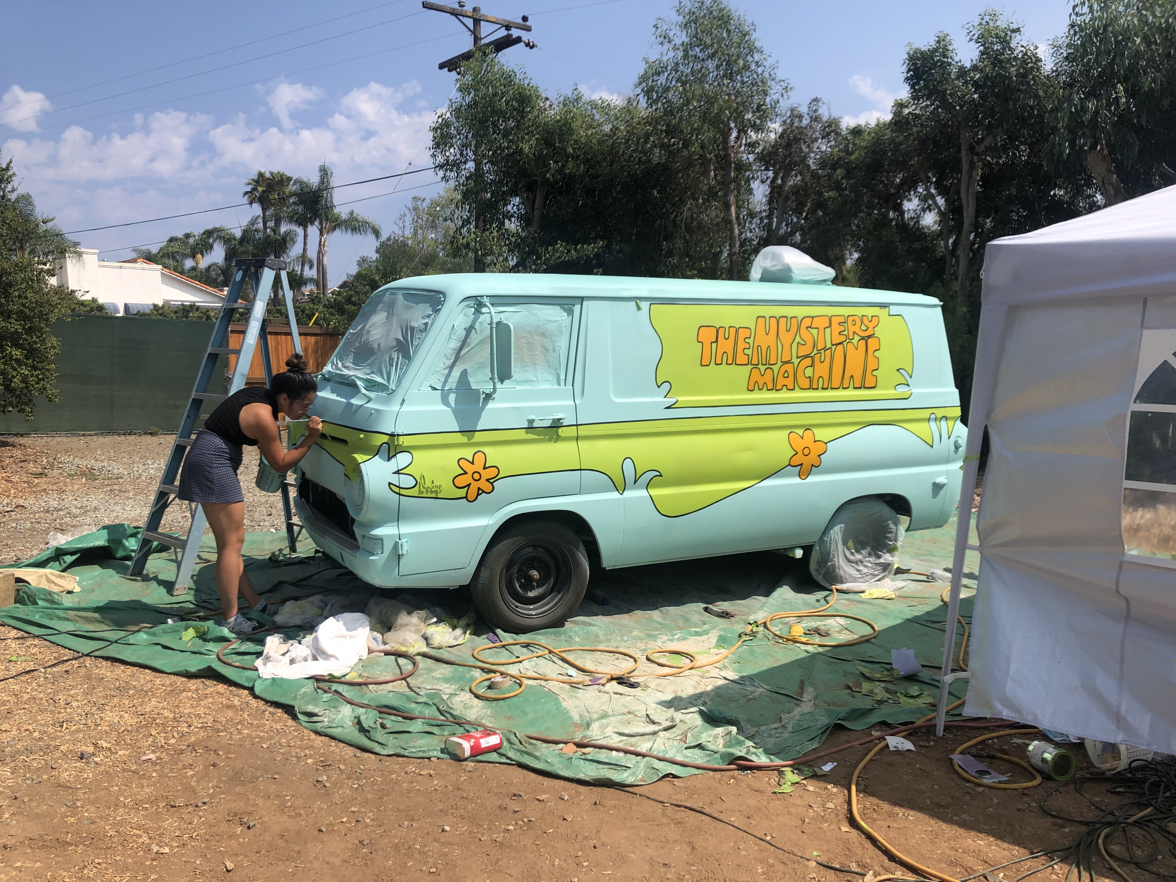 Emily carefully painting the lines.